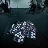 A stack of Certified Athletics' 10-class Punch Pass Cards on a bench in the gym